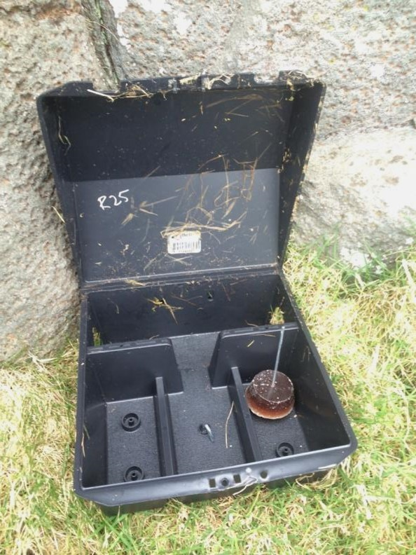 Open biosecurity surveillance station showing fresh wax block  Tom Churchyard